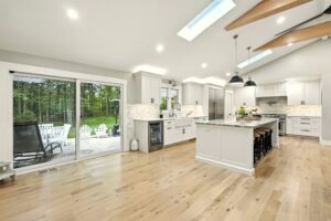 Bright modern kitchen with large island and skylights.