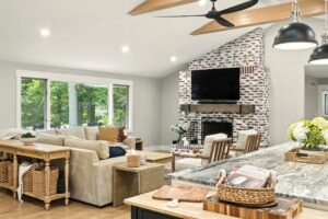 Cozy living room with stone fireplace and neutral-toned furniture.