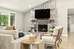 Cozy living room with brick fireplace and modern decor.