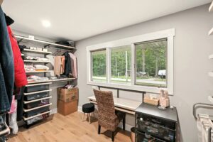 Bright, organized home office with natural light and minimalistic decor.