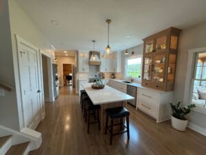 Bright kitchen with island and wooden accents.